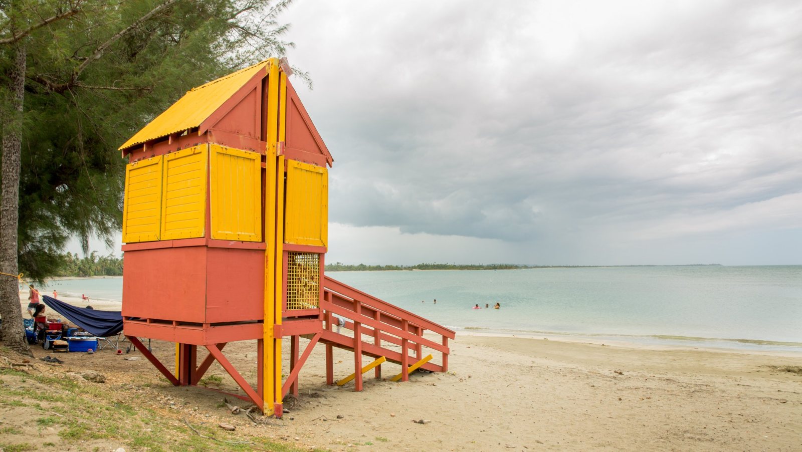 Colorful lifeguard tower and calm shallow water at a beach in Toa Baja, Puerto Rico